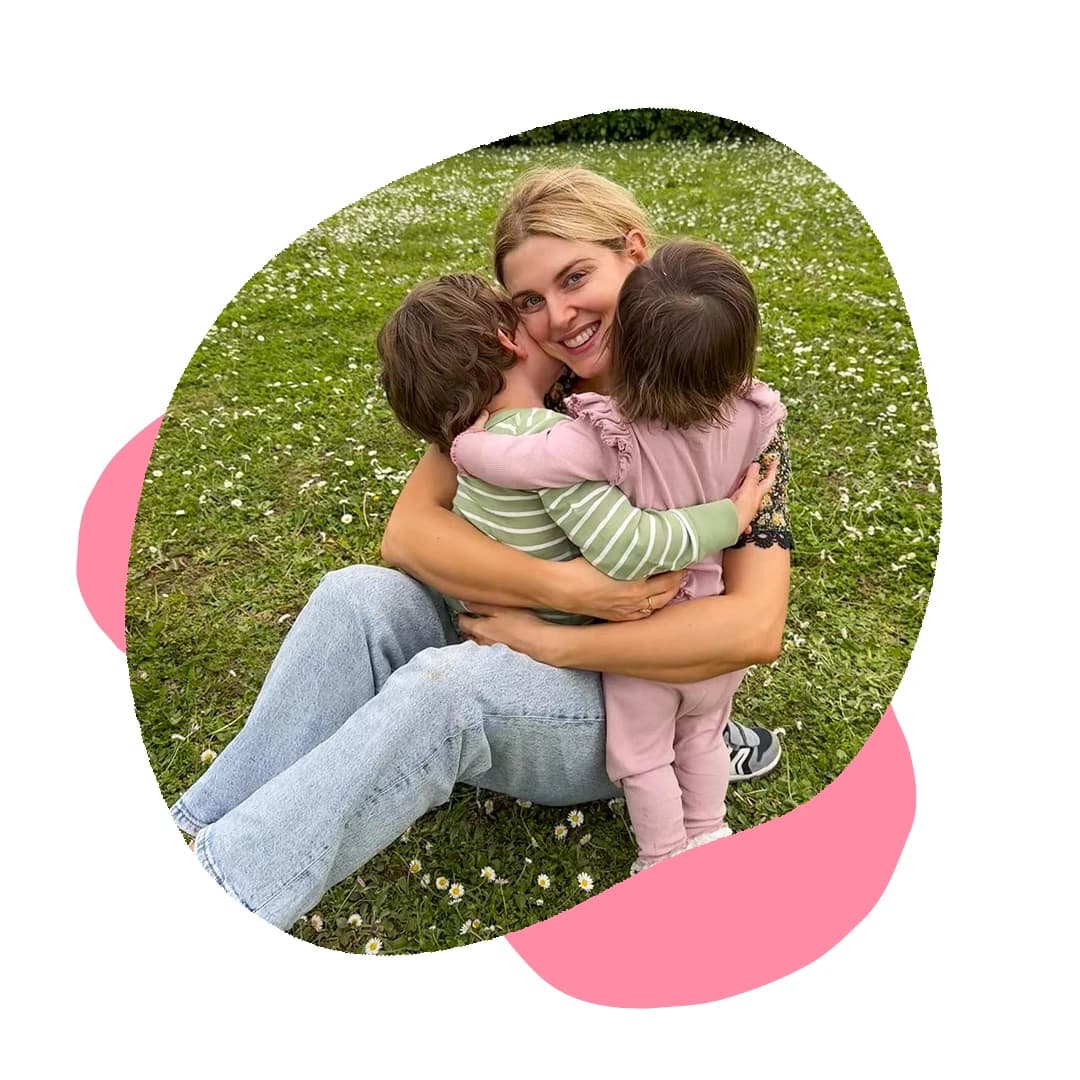 Ashley James hugs with her son and daughter in the garden