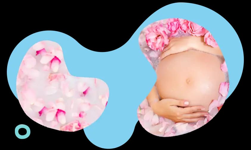 pregnant woman in bath with flower petals