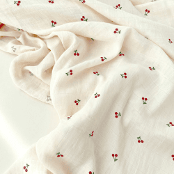 Image showing the The Cherry Muslin Swaddle Blanket, Cream product.